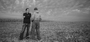 Attorney John Schwarz talks with a farmer.